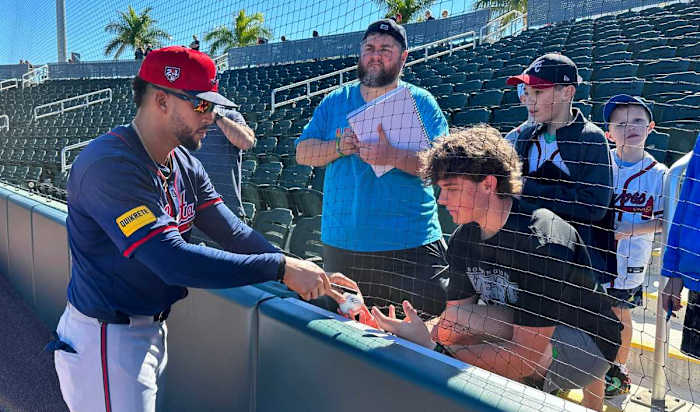 Atlanta Braves outfielder Luis Liberato (#76) signs autographs for a few fans before starting workout on Tuesday, Feb. 20, 2024 at CoolToday Park in North Port, Florida.